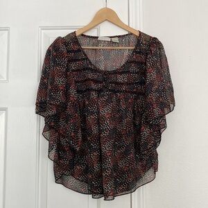 Passport shawl blouse with delicate floral print.
